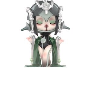 Green and Black Figurine